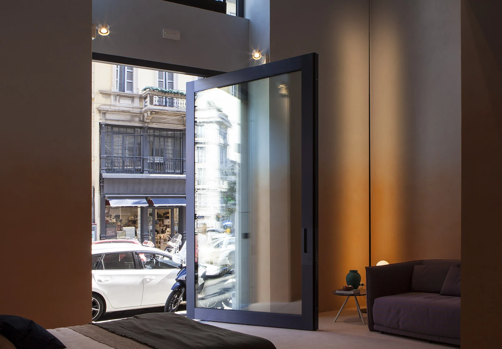 Oikos Nova glazed pivot entrance within a modern facade.