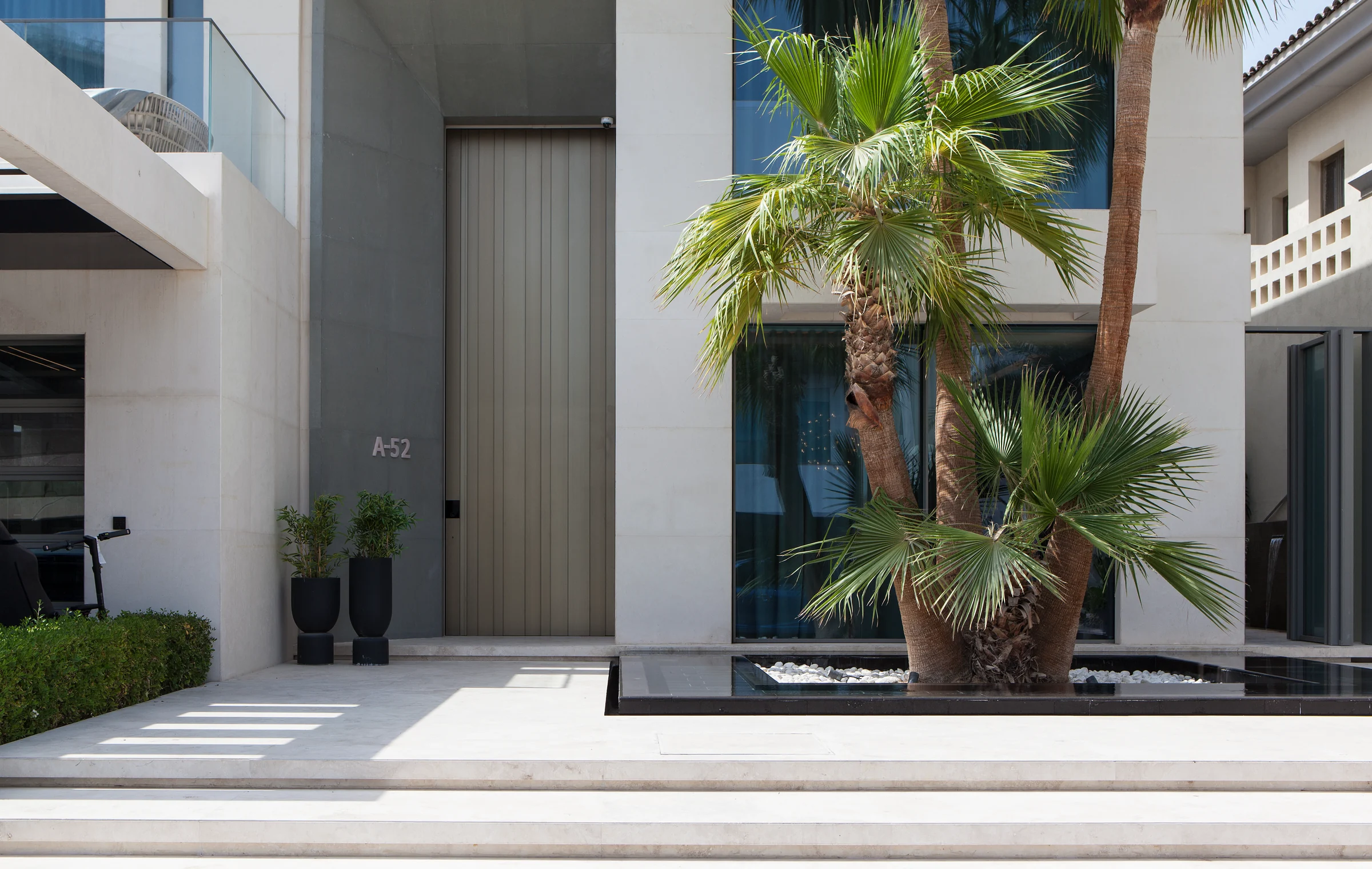 Villa 13 in Dubai: recessed entrance and landscaped approach.