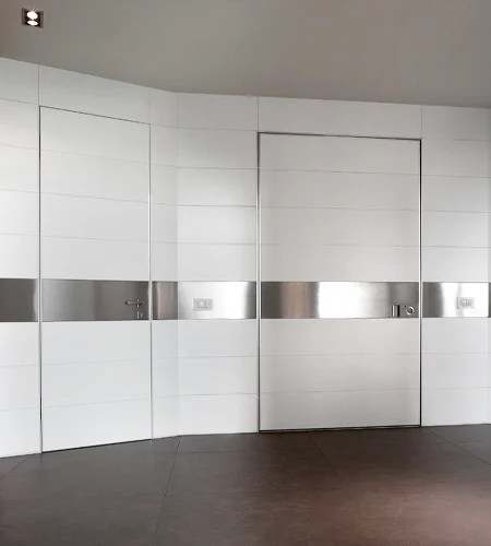 Oikos Project door within coordinated wall cladding.