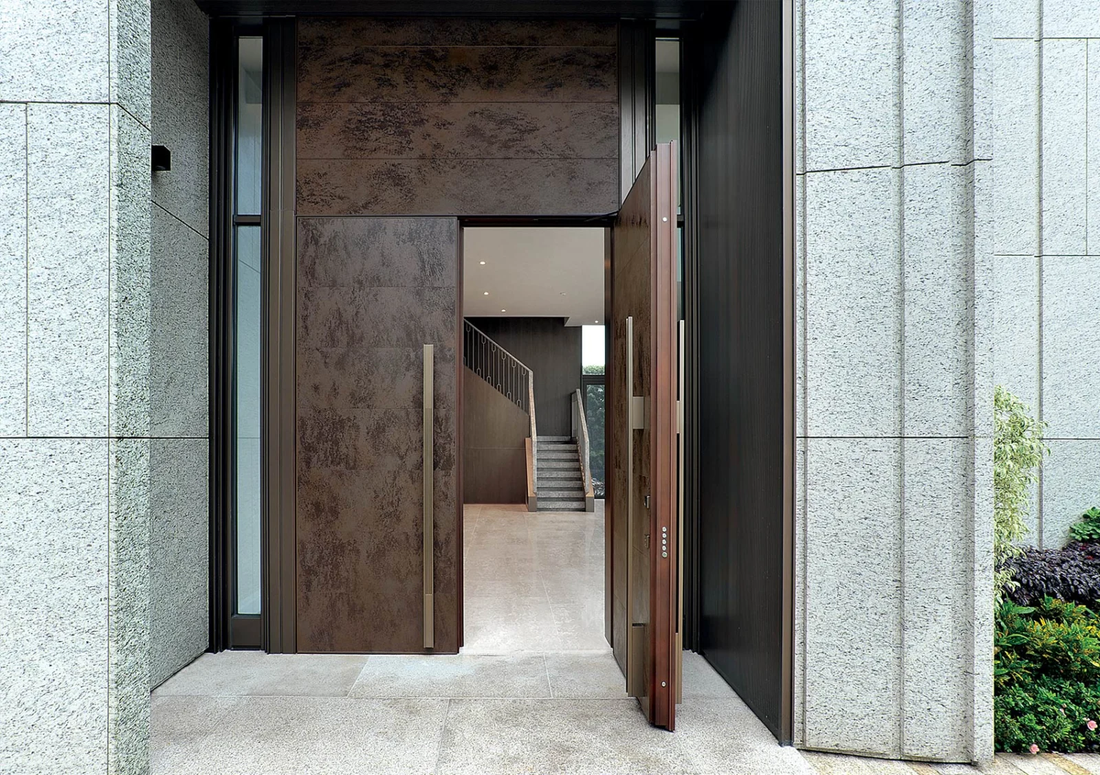 Oikos Tekno entrance door in an architectural setting.
