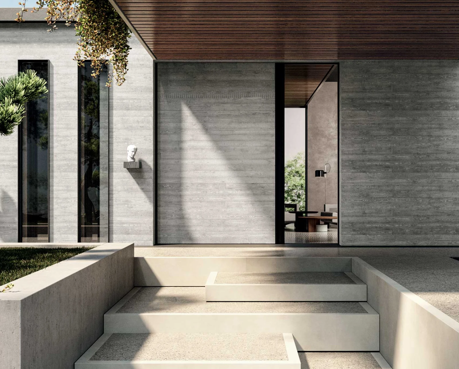 Oikos Vela sliding entrance integrated into a contemporary wall.